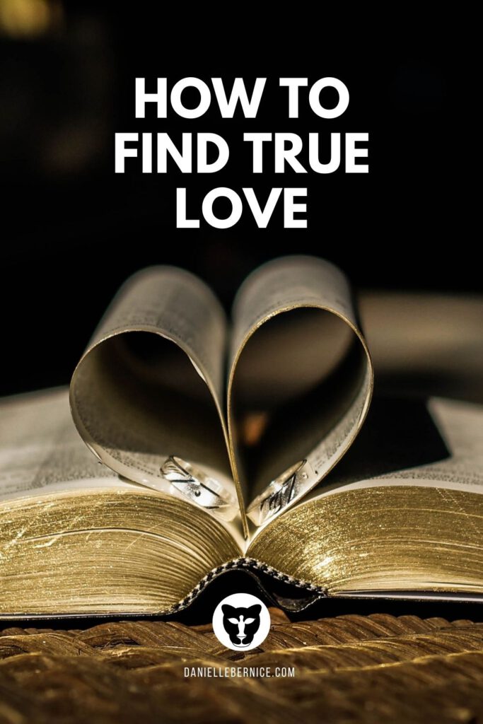Bible pages enclosing wedding rings in a heart shape